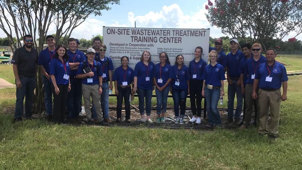 David Smith (far right) leading a group of 4-H Water Ambassadors on a tour of the Texas A&M On-site Wastewater Treatment Training Center on the RELLIS campus.